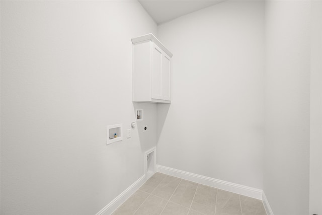 2297 High Plain Ln, Waxahachie, TX 75167 - laundry room with hookup for a washing machine, hookup for an electric dryer, cabinet space, gas dryer hookup, and light tile patterned floors