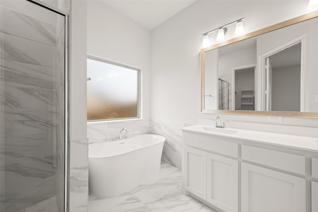 2297 High Plain Ln, Waxahachie, TX 75167 - full bathroom with marble finish flooring, vanity, a soaking tub, a stall shower, and wainscoting