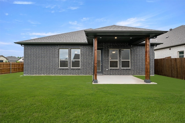 2297 High Plain Ln, Waxahachie, TX 75167 - rear view of house featuring brick siding, a patio area, and a shingled roof