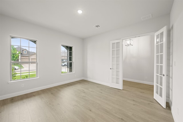 2297 High Plain Ln, Waxahachie, TX 75167 - unfurnished room with french doors, light wood-style flooring, baseboards, and recessed lighting
