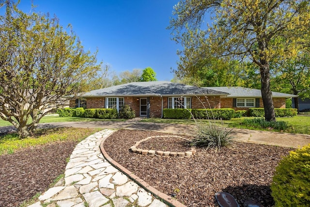 single story home with brick siding