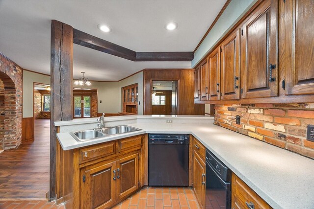 kitchen with a sink, dishwasher, and brown cabinets