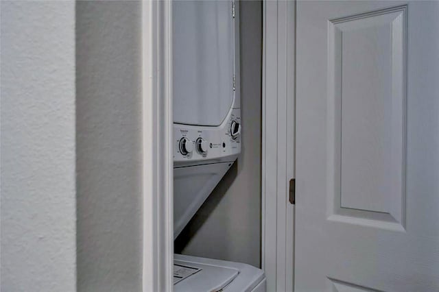 laundry room featuring stacked washer and clothes dryer