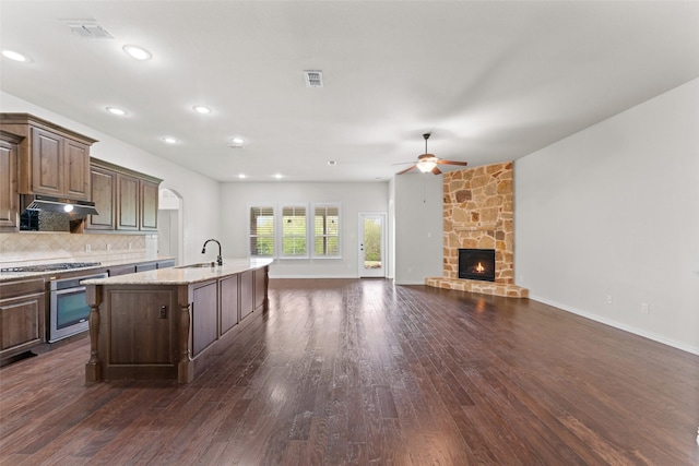 109 Joplin Dr, Mckinney, TX 75071 - kitchen featuring dark wood finished floors, a ceiling fan, visible vents, under cabinet range hood, and stainless steel appliances