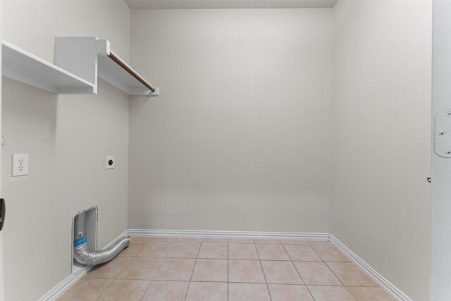 109 Joplin Dr, Mckinney, TX 75071 - clothes washing area with light tile patterned floors, baseboards, electric dryer hookup, and laundry area