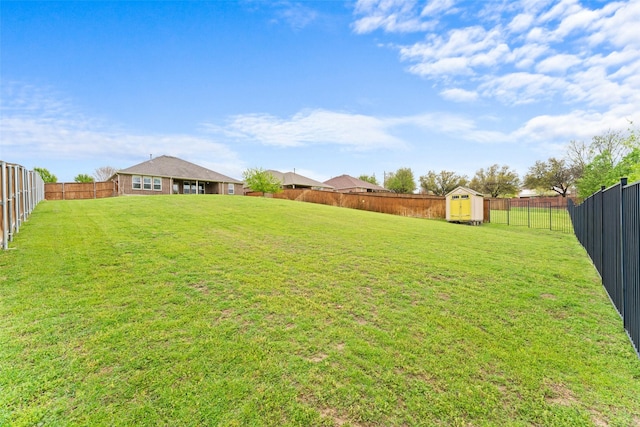 109 Joplin Dr, Mckinney, TX 75071 - view of yard with a storage shed, a fenced backyard, and an outdoor structure