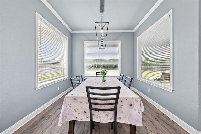 10281 Creekside Ln, Waco, TX 76712 - dining room with plenty of natural light, dark wood-type flooring, baseboards, and crown molding