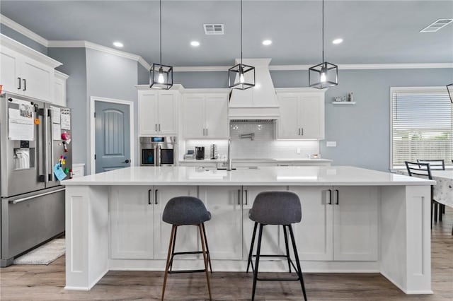10281 Creekside Ln, Waco, TX 76712 - kitchen with stainless steel appliances, ornamental molding, decorative backsplash, light countertops, and white cabinetry