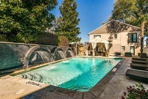 pool with a patio area