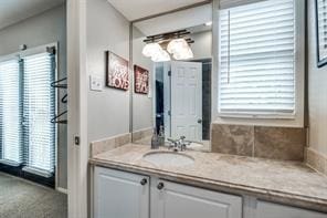 bathroom featuring a wealth of natural light and vanity