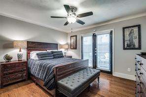 bedroom with baseboards, a ceiling fan, and wood finished floors