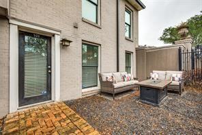 exterior space featuring outdoor lounge area, fence, and a patio