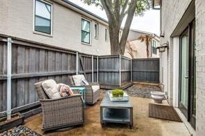view of patio featuring a fenced backyard and an outdoor hangout area