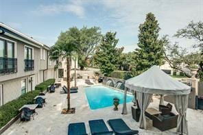 community pool featuring a patio area