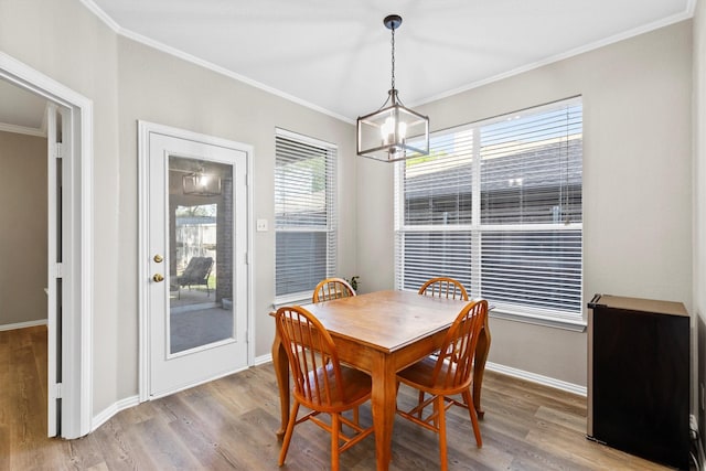 110 Harvest Bend Dr, Wylie, TX 75098 - dining room with ornamental molding, wood finished floors, a chandelier, and baseboards