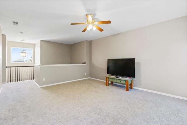 110 Harvest Bend Dr, Wylie, TX 75098 - unfurnished living room featuring a ceiling fan, carpet floors, baseboards, and a chandelier