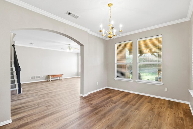 110 Harvest Bend Dr, Wylie, TX 75098 - unfurnished room with arched walkways, a ceiling fan, crown molding, wood finished floors, and a chandelier