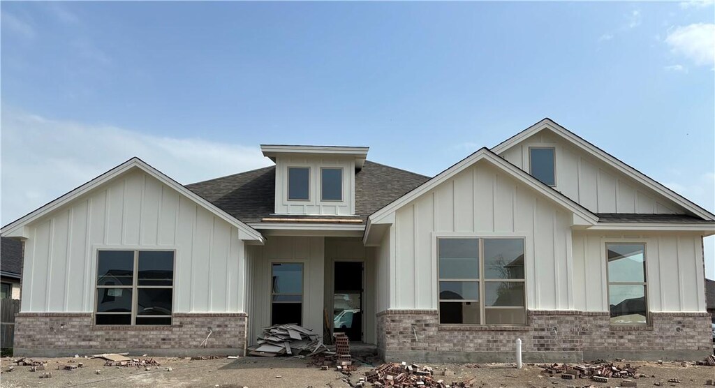 5408 Black Horse Ct, Waco, TX 76708 - view of front facade featuring brick siding, board and batten siding, and roof with shingles