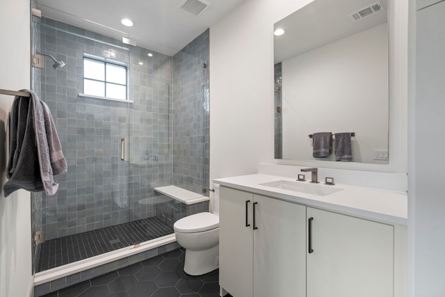 7158 Pasadena Ave, Dallas, TX 75214 - bathroom with toilet, tile patterned flooring, a stall shower, vanity, and recessed lighting