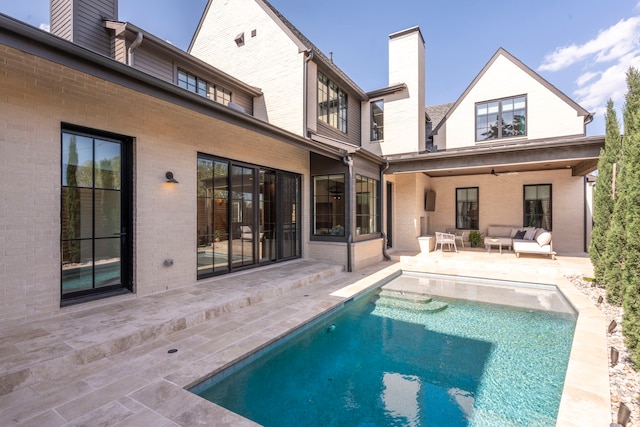 7158 Pasadena Ave, Dallas, TX 75214 - back of property with a chimney, brick siding, outdoor lounge area, and a patio area