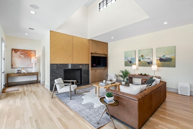 7158 Pasadena Ave, Dallas, TX 75214 - dining room with light wood finished floors, a fireplace, and recessed lighting