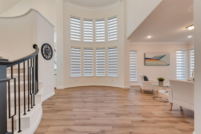1108 Silverthorn Trl, Justin, TX 76247 - entryway with crown molding, light wood-style floors, recessed lighting, baseboards, and stairs