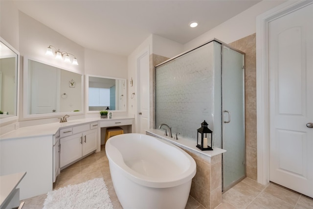 1108 Silverthorn Trl, Justin, TX 76247 - bathroom featuring vanity, a shower stall, a soaking tub, tile patterned flooring, and recessed lighting