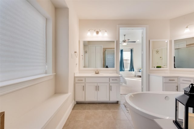 1108 Silverthorn Trl, Justin, TX 76247 - bathroom featuring a shower stall, a soaking tub, vanity, and ceiling fan