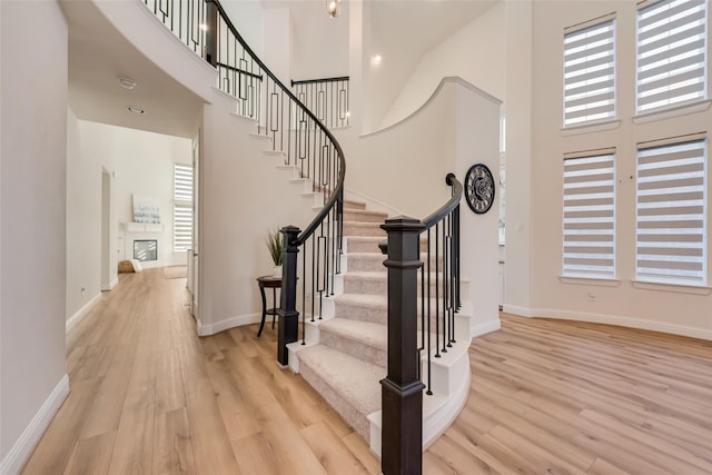 1108 Silverthorn Trl, Justin, TX 76247 - entryway with a high ceiling, wood finished floors, plenty of natural light, stairs, and baseboards