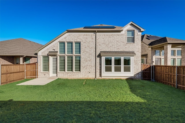 1108 Silverthorn Trl, Justin, TX 76247 - rear view of property featuring brick siding and solar panels