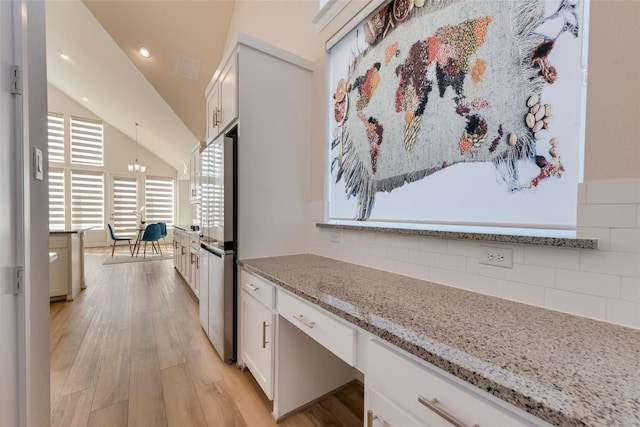 1108 Silverthorn Trl, Justin, TX 76247 - corridor with light wood finished floors, vaulted ceiling, a chandelier, and recessed lighting