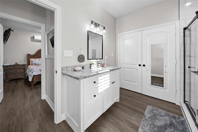 12908 County Road 463, Tyler, TX 75706 - bathroom with vanity, an enclosed shower, ensuite bathroom, and wood finished floors