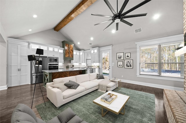 12908 County Road 463, Tyler, TX 75706 - living room featuring visible vents, a ceiling fan, dark wood-style floors, beamed ceiling, and high vaulted ceiling