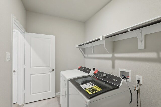 washroom with laundry area and washer and dryer