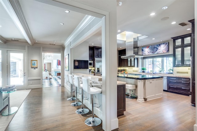 10989 Crooked Creek Dr, Dallas, TX 75229 - bar area with island exhaust hood, ornamental molding, light wood finished floors, recessed lighting, and stainless steel dishwasher