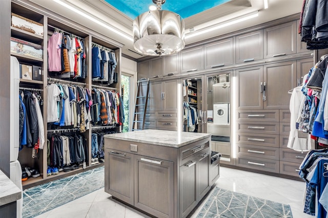 10989 Crooked Creek Dr, Dallas, TX 75229 - spacious closet featuring light tile patterned floors and a chandelier