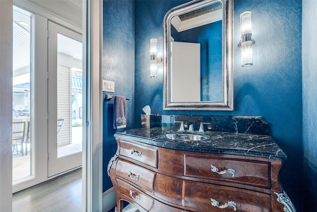 10989 Crooked Creek Dr, Dallas, TX 75229 - bathroom featuring wood finished floors, vanity, and ornamental molding