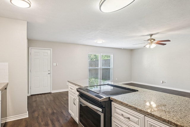 716 Meadow Mead Dr, Allen, TX 75002 - kitchen with electric range, dark wood-style floors, ceiling fan, light stone countertops, and baseboards