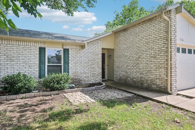 716 Meadow Mead Dr, Allen, TX 75002 - view of exterior entry with a garage and brick siding
