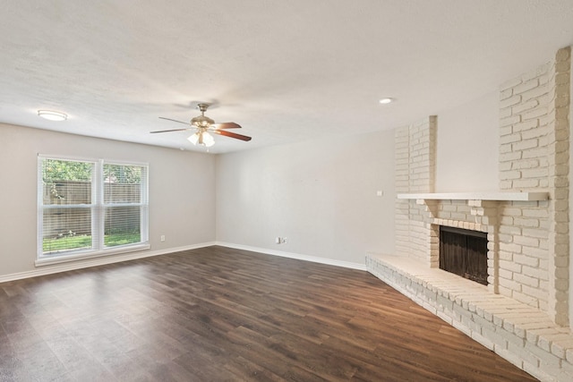 716 Meadow Mead Dr, Allen, TX 75002 - unfurnished living room with a ceiling fan, dark wood finished floors, baseboards, and a brick fireplace