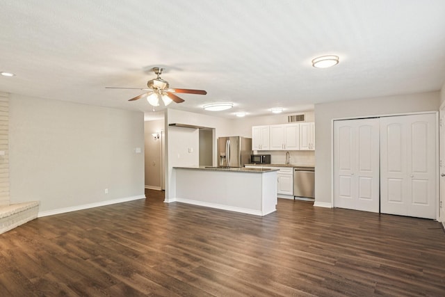 716 Meadow Mead Dr, Allen, TX 75002 - unfurnished living room featuring ceiling fan, dark wood-type flooring, a sink, and baseboards