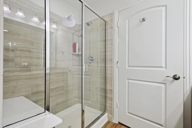 bathroom featuring a shower stall