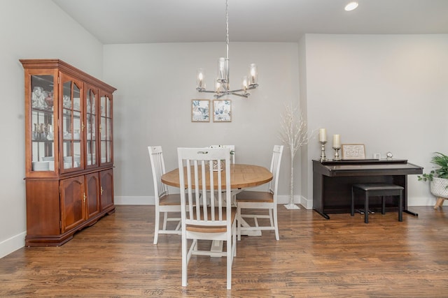 dining area with wood finished floors, a chandelier, recessed lighting, and baseboards