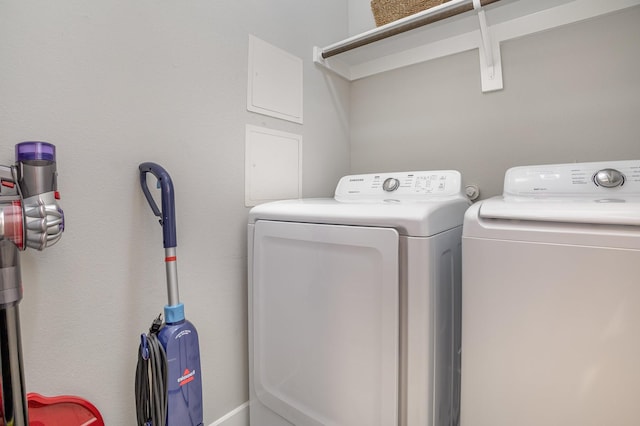 laundry room featuring washing machine and clothes dryer and laundry area