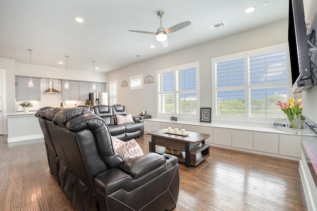 living room featuring recessed lighting, wood finished floors, visible vents, and ceiling fan