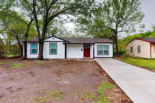 6840 Hillmont Dr, Dallas, TX 75217 - view of front of house with concrete driveway and fence