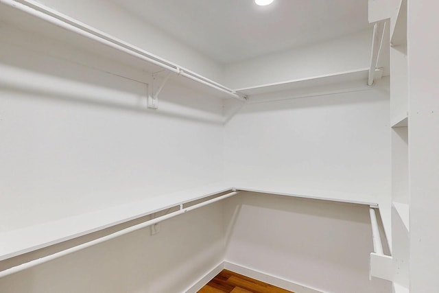 6840 Hillmont Dr, Dallas, TX 75217 - spacious closet with wood finished floors