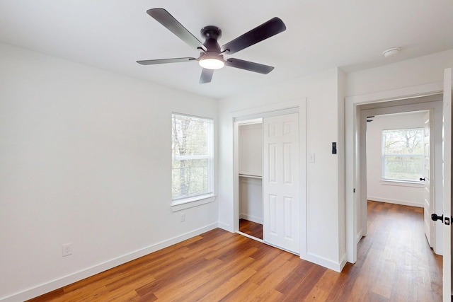 6840 Hillmont Dr, Dallas, TX 75217 - unfurnished bedroom with light wood-type flooring, a closet, baseboards, and a ceiling fan