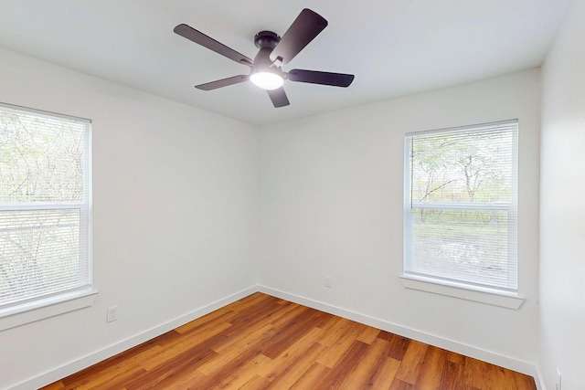 6840 Hillmont Dr, Dallas, TX 75217 - empty room with baseboards, light wood finished floors, and a ceiling fan