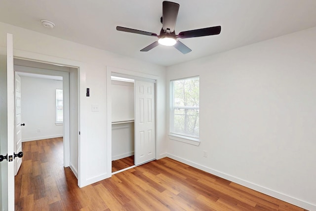 6840 Hillmont Dr, Dallas, TX 75217 - unfurnished bedroom with a closet, baseboards, a ceiling fan, and wood finished floors